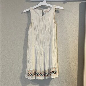 Sleeveless White Dress with Embroidered Hem